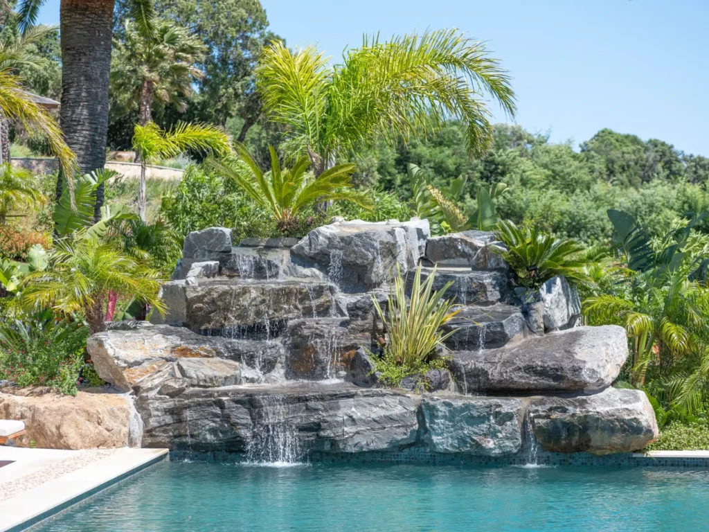 Waterfall built by Adonis at the edge of a pool