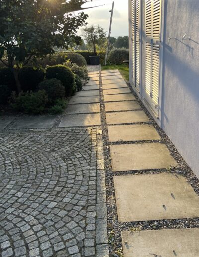 Before view of a garden path with stone pavers, prior to landscaping improvements