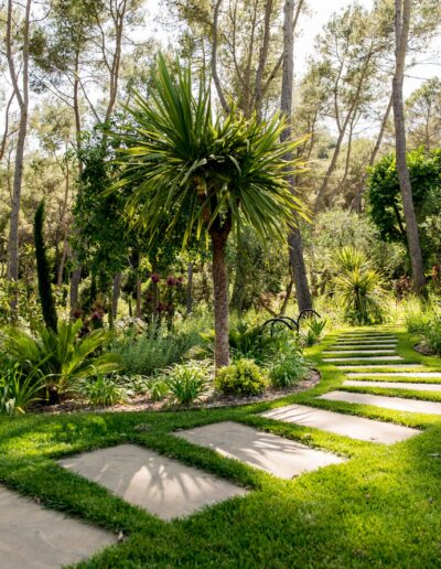 Stepping-stone pathway crossing a natural, flower-filled garden in Mougins