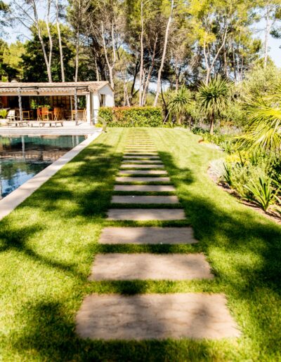 Stepping-stone path leading to the pool in a wooded garden in Mougins
