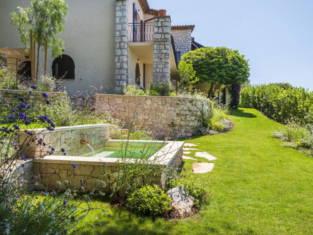Stone basin, a former washhouse, matching the architecture of the house